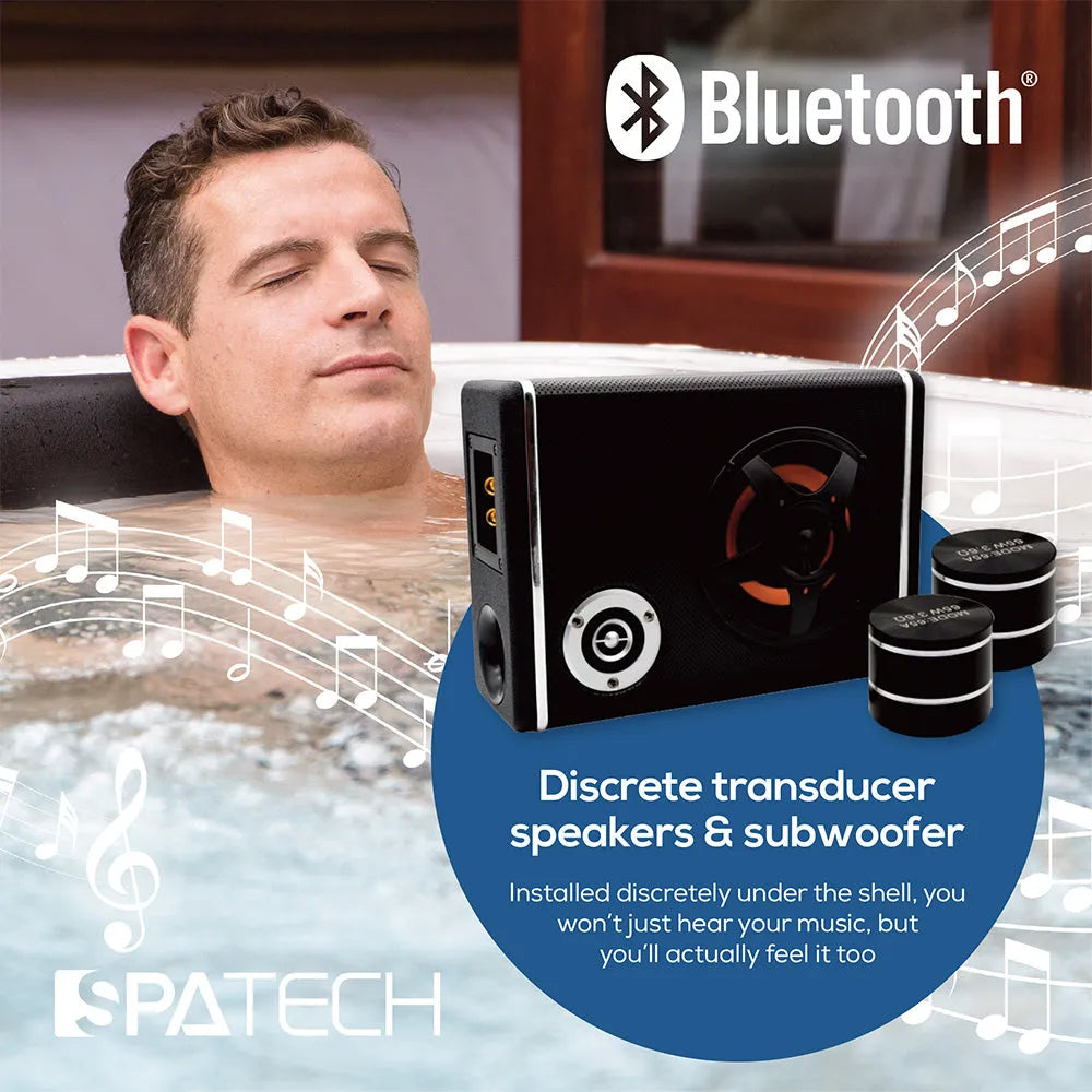 A man relaxes in a hot tub with his eyes closed. Beside him is an image of a speaker and subwoofer with musical notes. The text highlights Bluetooth connectivity and discrete transducer speaker technology offered by the Oasis Riptide - Easy Life Pro 8.0 with Inverter Swim Spa for an immersive audio experience from Oasis Spas.