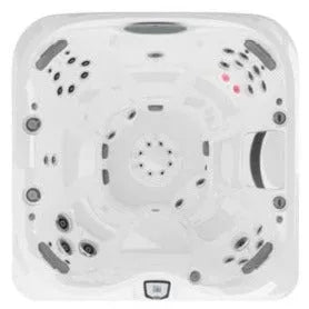 A top-down view of a white J-445™ Open Seated Hot Tub with Infrared & Red Light Therapy by Jacuzzi with multiple Jacuzzi PowerPro jets strategically placed around the sides and circular patterns. Small red LED lights accent one corner of the square tub with rounded edges, enhancing the hydrotherapy experience.
