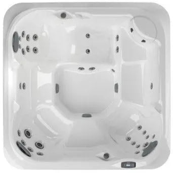 Top view of the J-235 CLASSIC HOT TUB WITH LOUNGE SEAT - NEW MODEL by Jacuzzi with multiple seating positions and various water jets. The hot tub has a rectangular shape with rounded corners, an integrated control panel on one side, a ProClassic™ filter for clean water, and indulgent hydromassage for ultimate relaxation.