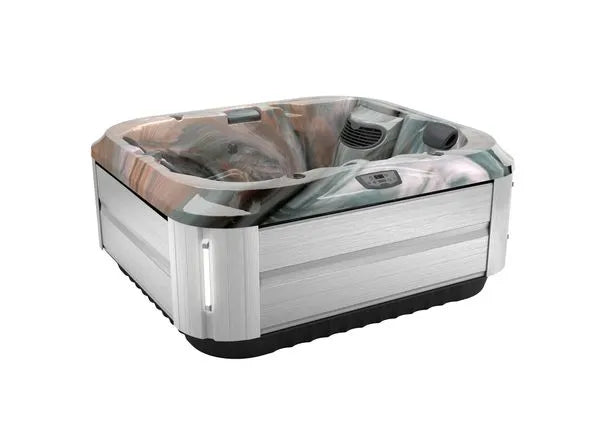 A modern rectangular J-315 COMFORT HOT TUB WITH LOUNGER FOR SMALL SPACES by Jacuzzi with a sleek, silver exterior and marbled interior design. It features digital controls, built-in seats, and multiple PowerPro® jets for a luxurious hydrotherapy experience. The hot tub is elevated on a black base with lighting accents on the corners.