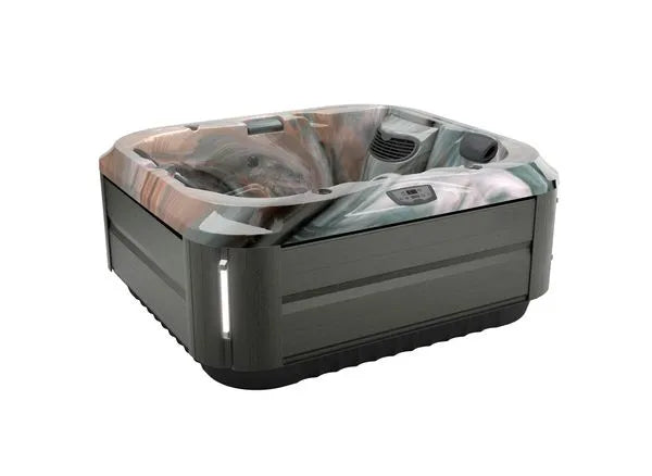 A J-315 COMFORT HOT TUB WITH LOUNGER FOR SMALL SPACES from Jacuzzi is shown. It features wood-like exterior paneling, a marbled interior with multiple seating areas, and PowerPro® jets that offer hydrotherapy benefits. The control panel is mounted on the inner rim, and LED lights are integrated into the corners.