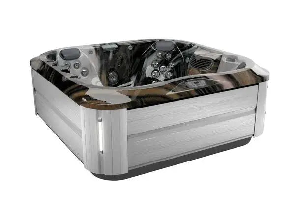 A sleek, modern hot tub with a square shape and rounded corners. It features multiple jets with Jacuzzi® PowerPro® jet technology and seating areas in a stylish combination of wood and metallic finishes. The J-335 COMFORT HOT TUB WITH OPEN SEATING by Jacuzzi has integrated controls and LED lighting, providing a luxurious and inviting appearance.