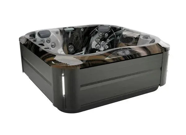 Image of a modern hot tub with a dark gray exterior and black marble-like interior, featuring Jacuzzi® PowerPro® jet technology and ProClear® filtration system. The J-335 COMFORT HOT TUB WITH OPEN SEATING by Jacuzzi boasts multiple water jets and an electronic control panel. It has a sleek, square design with LED lights on the exterior corners.