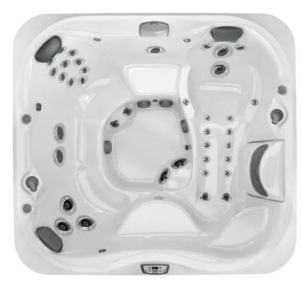 A top view of a Jacuzzi J-355 HOT TUB WITH COMFORT LOUNGE SEATING & COOL DOWN SEAT featuring multiple seats with built-in headrests, numerous hydrotherapy jets, and a control panel. The hot tub includes various seating configurations, including a lounge seat with jets for targeted hydrotherapy and the ProClear filtration system.