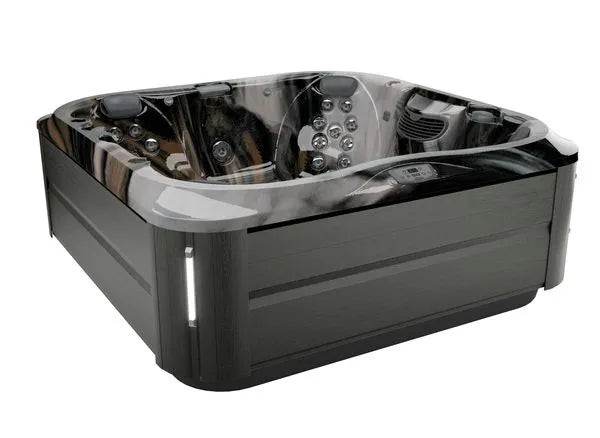 A modern, square hot tub with a sleek black exterior and multiple built-in jets and controls, featuring advanced hydromassage technology. The Jacuzzi J-375 COMFORT HOT TUB WITH LARGEST LOUNGE SEAT NEW has a gray and black marbled interior finish and appears to seat four to six people, suitable for both indoor and outdoor installation.