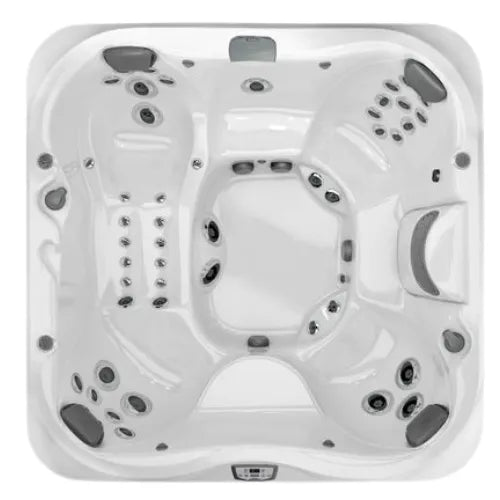 A top-down view of the white, square J-375 COMFORT HOT TUB WITH LARGEST LOUNGE SEAT NEW by Jacuzzi with multiple built-in seats and various jets. The design includes ergonomic seating, armrests, and headrests, showcasing a spacious interior for multiple occupants. Advanced hydromassage technology and control panels are visible for ultimate relaxation.