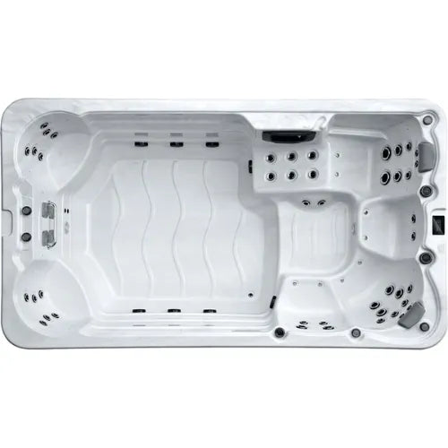 A top-down view of a rectangular white Oasis Riptide - Aqua Life Hydro 4.0 Swim Spa by Oasis Spas. The spa features multiple seating areas with Power Flow Swim Jets arranged around the interior, and handrails on one side. The bottom has a smooth, contoured shape.