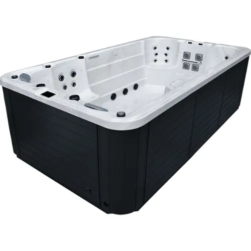 A rectangular, above-ground hot tub with a sleek, dark exterior and a white interior featuring multiple water jets and seating areas. The Oasis Riptide - Aqua Life Hydro 4.0 Swim Spa from Oasis Spas incorporates Power Flow Swim Jets for enhanced relaxation and hydrotherapy, with various controls and ergonomic placements for comfort.
