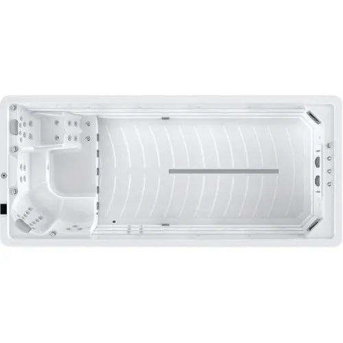 Top view of a large, rectangular white Oasis Riptide - Aqua Life Hydro 5.5 Swim Spa featuring massaging jets, a seating area with built-in headrests, and a spacious swim area. There are also Power Flow Swim Jets for advanced resistance training and handles and steps for easy access.