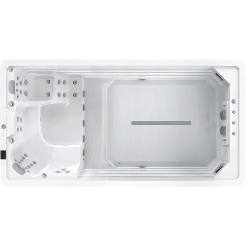 Overhead view of a rectangular swim spa. The spa features a dedicated swimming area on the right with a lane marker and multiple water jets on the left side. The left section, equipped with seating and built-in massage jets, includes Oasis Riptide - Easy Life Pro 4.4 with Inverter Swim Spa by Oasis Spas and variable speed pumps for enhanced performance.