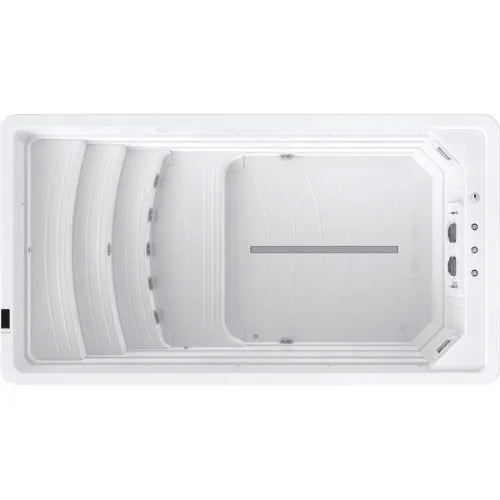 Top view of a white rectangular swim spa with evenly spaced water jets on one end, a grate along the middle for water circulation, and smooth, contoured seating on the side opposite the jets. The sleek interior boasts the advanced SPATECH TP10 system for optimal performance and ease of use. Introducing the Oasis Riptide - Atlantis Pro Premium 4.4 Swim Pool with Inverter by Oasis Spas.