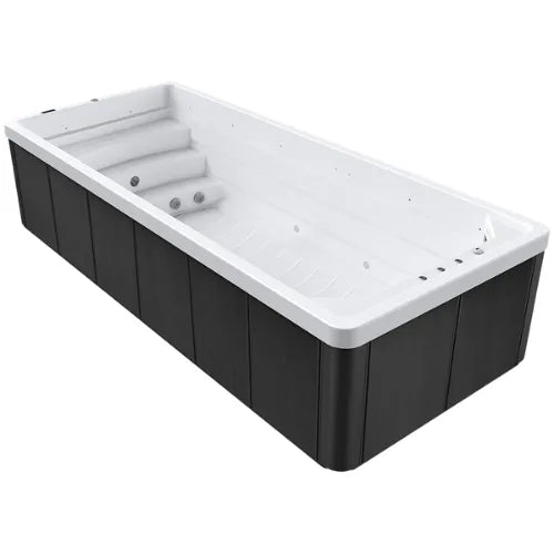 A rectangular Oasis Riptide - Atlas Hydro 6.0 Swim Pool by Oasis Spas with a white interior and black exterior panels. Inside, there are multiple seats with built-in Power Flow Swim Jets and a staircase leading into the tub. The design is modern and sleek, ideal for a backyard or spa setting.