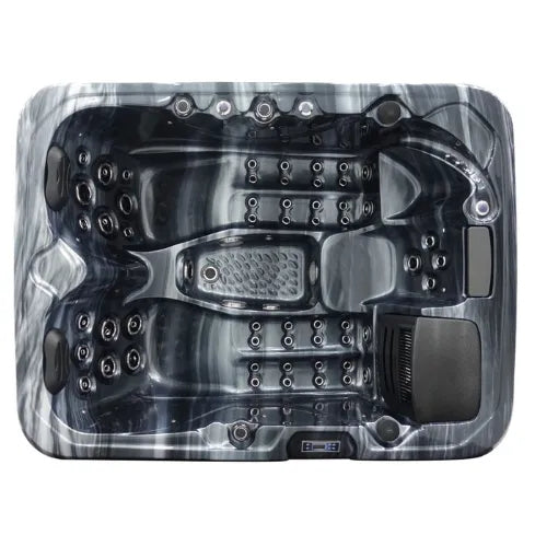 Aerial view of a high-end, black marble Hot Tub Liverpool Atlanta - 2-3 Person Hot Tub featuring multiple customizable jets and seating areas. The tub has a streamlined, contemporary design with advanced Balboa Control Systems and a textured, slip-resistant floor in the center.