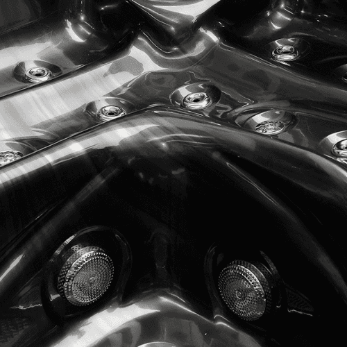 Close-up of Neptune hot tub's hydrotherapy jets.