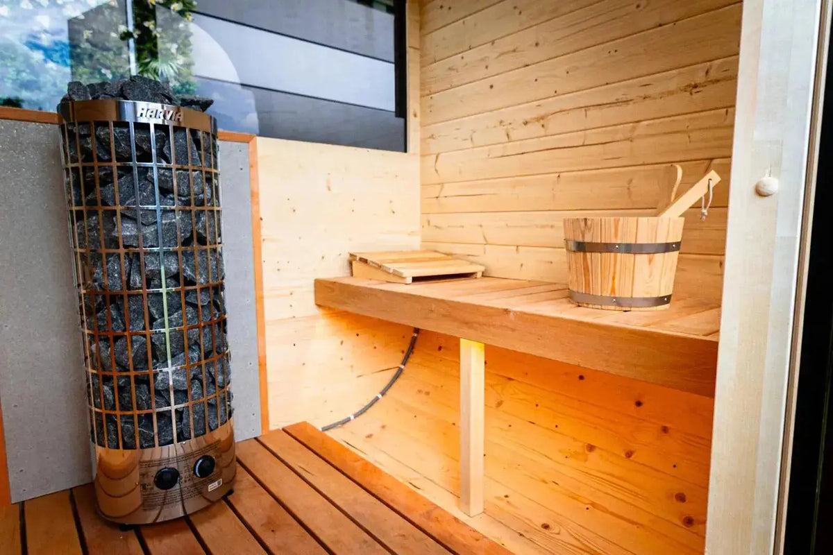 Harvia heater inside Woodpecker 2024 Cube Sauna