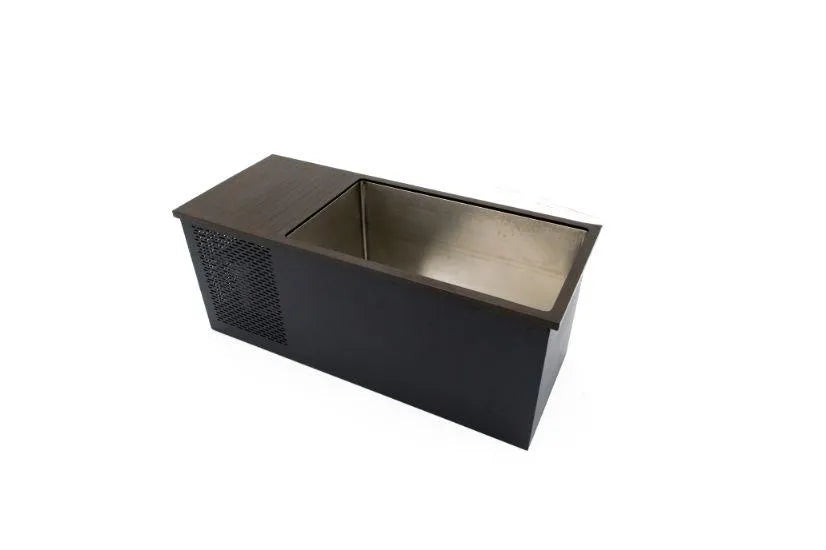 A rectangular, black metal beverage cooler with a small vent on one side. The Chill Tubs - Professional affordable Ice Baths ideal for gym fanatics has an open top with a spacious interior designed to hold ice and drinks. The minimalist design is set against a plain white background, making it perfect for cold water therapy sessions.