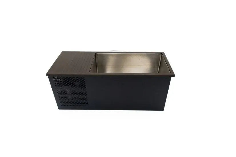 A rectangular black and stainless steel ice bin, resembling a Chill Tubs - Professional affordable Ice Baths ideal for gym fanatics, is isolated against a white background. The bin has an open top, revealing its interior, and features a ventilation grille on one side, making it ideal for cold water therapy sessions.