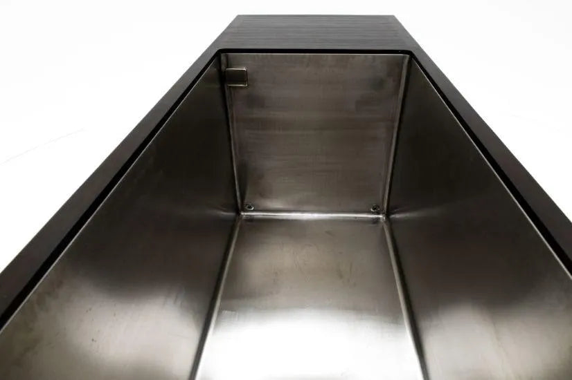 A Chill Tubs - Professional affordable Ice Baths ideal for gym fanatics by Chill Tubs with a polished interior and dark-colored exterior. The image shows the spacious, deep container, perfect for cold water therapy, emphasizing the smooth metal surface and industrial appearance.