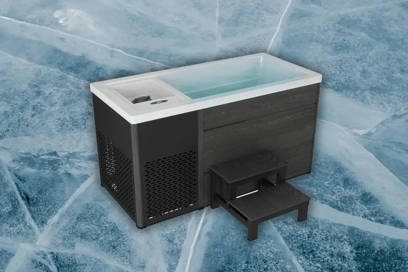 A modern black and white Chillax Ice Bath & Chill Tub Professional affordable wellness Ice Baths & Plunge Pool with steps in front, set against an icy textured background. The unit has an open top filled with water for effective cold water immersion and features a perforated side panel for ventilation, aiding in inflammation reduction.