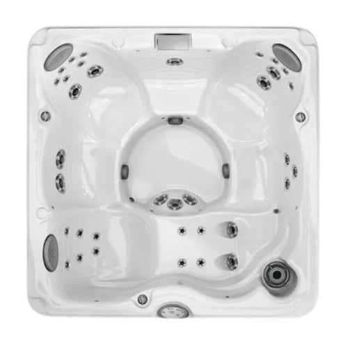 A top-down view of a clean, empty, white J-235™ Classic Hot Tub with Lounge Seat - OLD MODEL by Jacuzzi with multiple seating areas and water jets. The hot tub features various jet placements, hydrotherapy options, and control panels designed for comfort and relaxation, including a lounge seat for the ultimate experience.