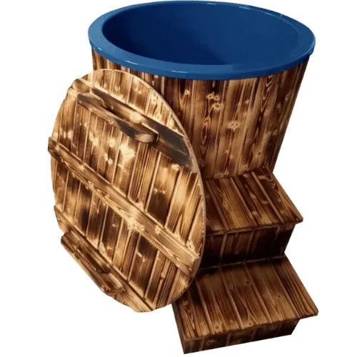 A rustic-style, round hot tub with a blue interior and wooden exterior doubles as a perfect spot for ice baths. The Solo Ice Bath (Chiller not Included) by Sunbeach Spas features a matching wooden cover, leaning against it, and two small built-in wooden steps for easy access—ideal for recovery routines that stimulate the vagus nerve.