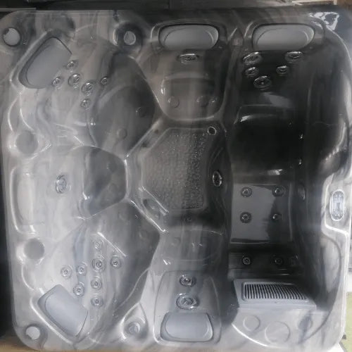 Top view of an empty gray Sunbeach Spas - SB349L - Standard - (13 Amp) featuring multiple seating areas, various jet placements, and a built-in Balboa TP500S control panel. The tub has a sleek, modern design with ergonomic seating and footrests, made from a durable USA Aristech Acrylic Shell by Hot Tub Liverpool.