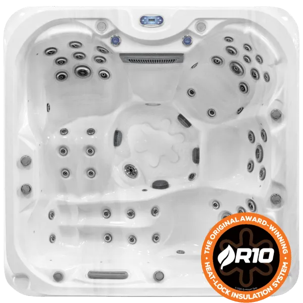 A white, square Sunbeach Spas - SB388DL-LUX (32Amp) from Hot Tub Liverpool with multiple seating areas and numerous water jets arranged around the interior. The hot tub features a Balboa TP600 Control Panel and a prominent R10 Heatlock Insulation System badge in the lower right corner, showcasing its advanced Aristech Acrylic design.